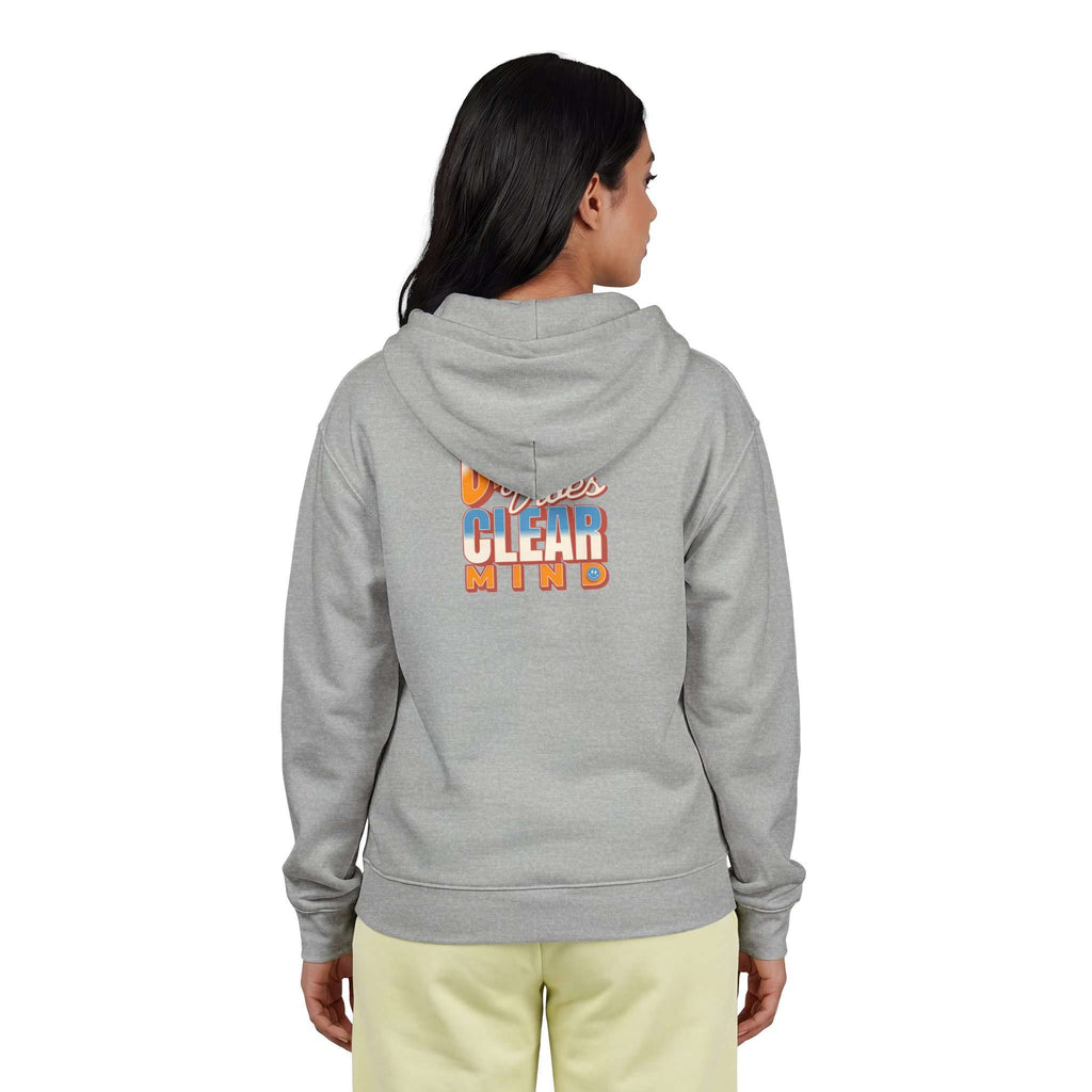 A woman viewed from the back wearing a heather gray hoodie with a large gold crown graphic and the words 'I'M A QUEEN' on the back, paired with light yellow pants against a plain white background. Shop online Comfortable Chill Vibes Clear Mind Zip Hoodie Casual Wear for soft, everyday comfort, relaxed style, and an effortlessly calm look. Elevate your off-duty wardrobe with the Comfortable Chill Vibes Clear Mind Zip Hoodie—made for warmth, ease, and relaxed moments.