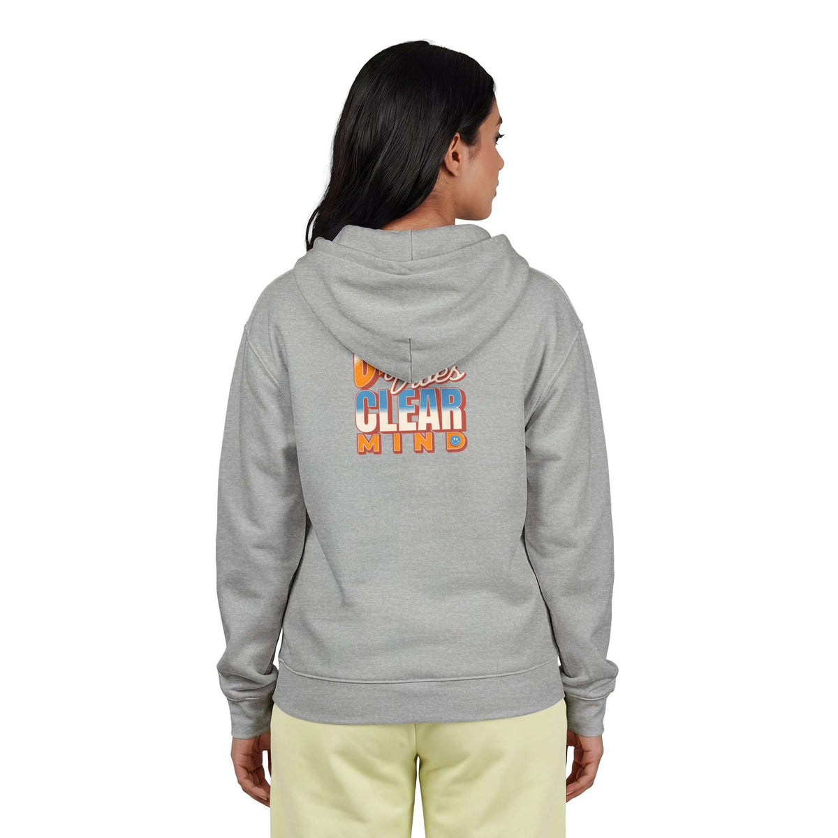 A woman viewed from the back wearing a heather gray hoodie with a large gold crown graphic and the words 'I'M A QUEEN' on the back, paired with light yellow pants against a plain white background. Shop online Comfortable Chill Vibes Clear Mind Zip Hoodie Casual Wear for soft, everyday comfort, relaxed style, and an effortlessly calm look. Elevate your off-duty wardrobe with the Comfortable Chill Vibes Clear Mind Zip Hoodie—made for warmth, ease, and relaxed moments.