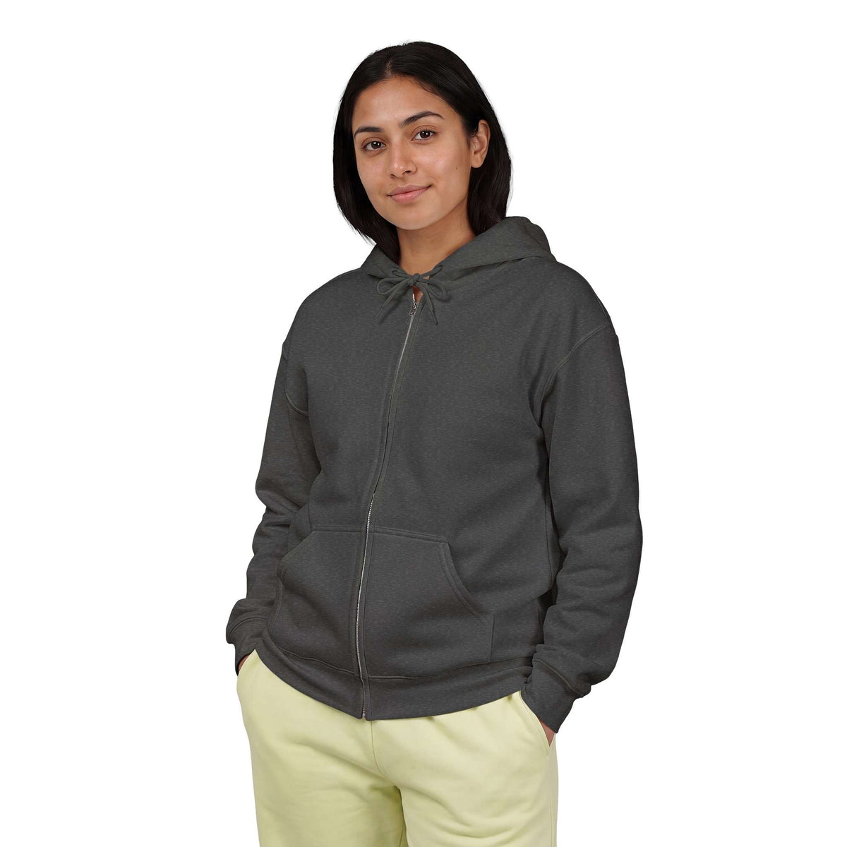 A woman wearing a dark charcoal gray zip-up hoodie with a drawstring hood and kangaroo pockets, paired with light yellow sweatpants, against a plain white background. Shop online Comfortable Chill Vibes Clear Mind Zip Hoodie Casual Wear for soft, everyday comfort, relaxed style, and an effortlessly calm look. Elevate your off-duty wardrobe with the Comfortable Chill Vibes Clear Mind Zip Hoodie—made for warmth, ease, and relaxed moments. Buy the Comfortable Chill Vibes Clear Mind Zip Hoodie, designed cozy.