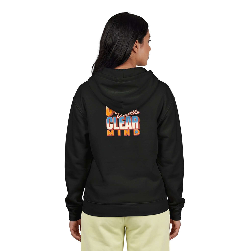 A woman viewed from the back wearing a black hoodie with a colorful graphic on the back that reads 'Minnesota Clear Mind,' paired with light beige pants, against a plain white background. Shop online Comfortable Chill Vibes Clear Mind Zip Hoodie Casual Wear for soft, everyday comfort, relaxed style, and an effortlessly calm look. Elevate your off-duty wardrobe with the Comfortable Chill Vibes Clear Mind Zip Hoodie—made for warmth, ease, and relaxed moments. Buy the Comfortable Chill Vibes Clear Mind Hoodie.
