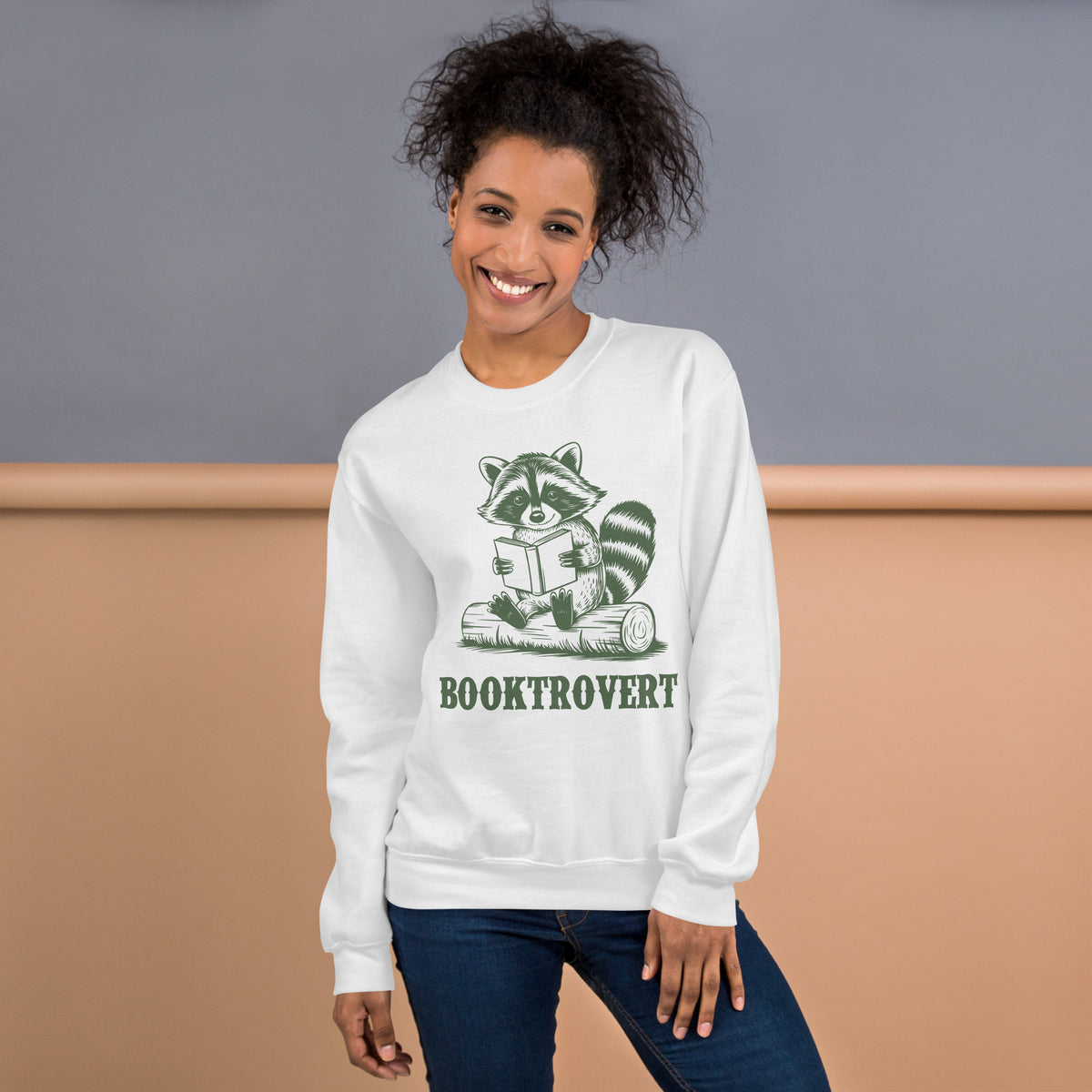 Shop Booktrovert Funny Sarcastic Raccoon Sweatshirt for Casual Outfits, a cozy statement piece for readers who prefer books, wit, and quiet company. Make your reading mood known with the Booktrovert Funny Sarcastic Raccoon Sweatshirt, designed for cozy days and clever bookworms. Buy Booktrovert Funny Sarcastic Raccoon Sweatshirt—soft, witty apparel for introverted book lovers with a playful edge.